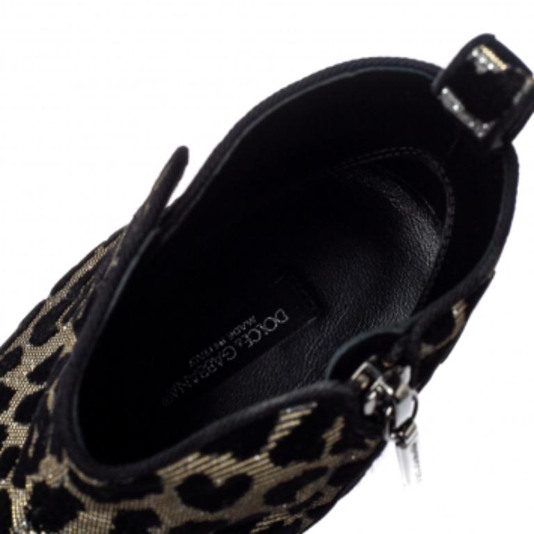These striking ankle boots from Dolce & Gabbana are a must-have to amp up your ensemble. Crafted meticulously from a luxe velvet and lurex, they carry a black and silver leopard print for a flattering look. They are styled with almond toes, zip
