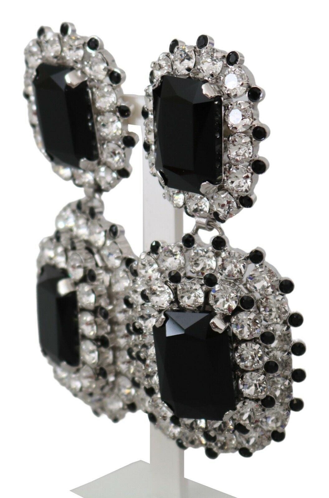 Gorgeous brand new with tags, 100% Authentic Dolce & Gabbana black and silver-tone drop clip-on earrings enriched by a decorative applique.




Model: Clip-on, drop
Motive: Crystals
Material: Brass, glass

Color: Black, silver

Crystal: Black

Logo