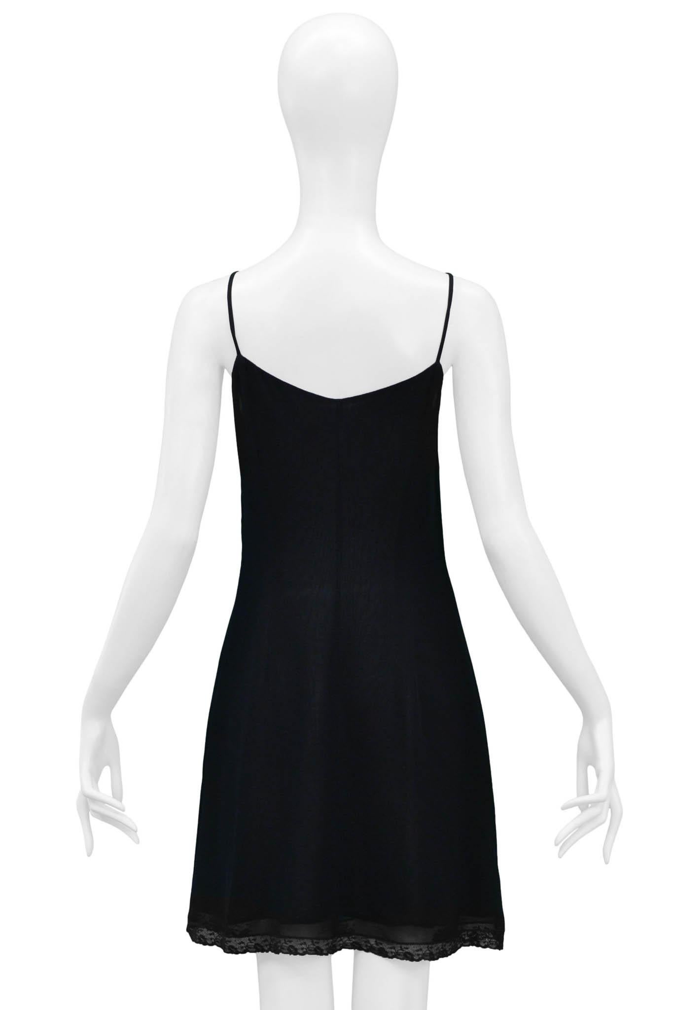 Resurrection Vintage is excited to offer a vintage Dolce & Gabbana black slip dress featuring spaghetti straps, lace trim at the hem, and an invisible zipper on the side seam. 

Dolce & Gabbana
Size 44
90% Rayon 10% Nylon
Excellent Vintage