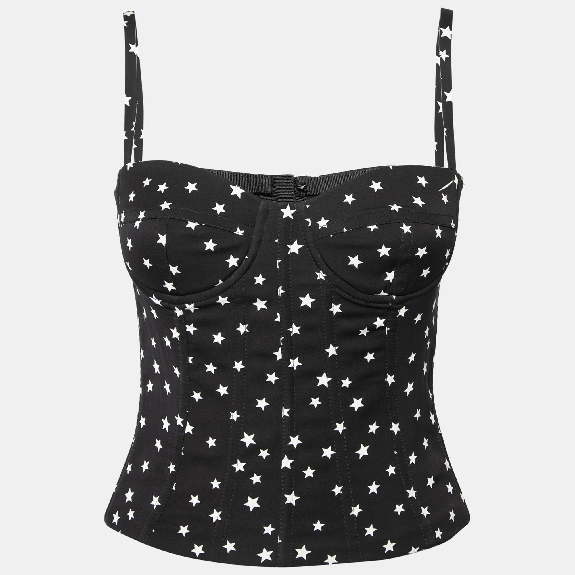 How cute is this corset top from Dolce & Gabbana! Chic and charming, this corset top is the perfect summer accessory with its black satin fabric and contrasting star prints. It can be secured with a zipper.

