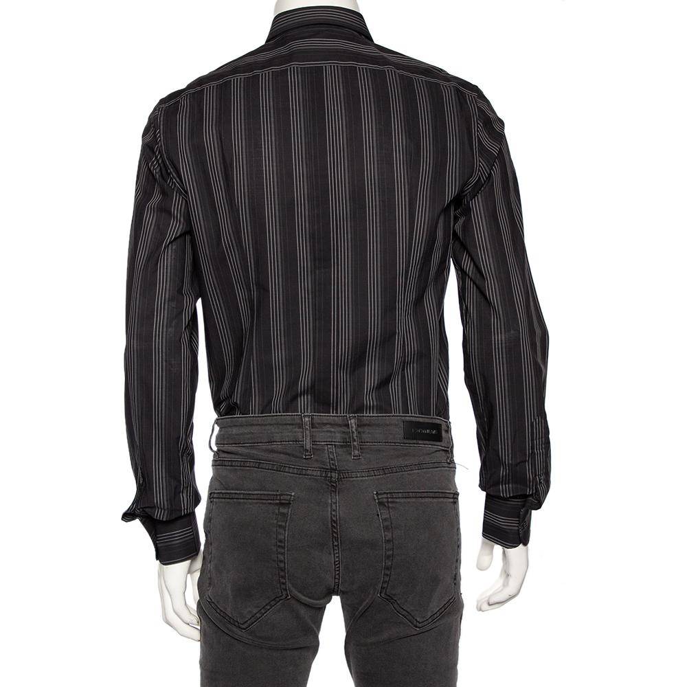 Shirts are an indispensable part of a man's wardrobe, so Dolce & Gabbana brings you a creation that is both versatile and stylish. It has been tailored from cotton in a black shade. The shirt is detailed with intricate stripe patterns and long