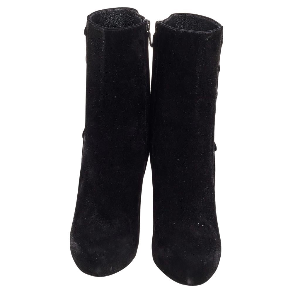 Add a reliable pair of boots to your winter edit with this pair of Dolce & Gabbana boots. Made of suede, they feature round toes, trim of buttons, side zip closure, leather-lined insoles, and 13 cm heels.

