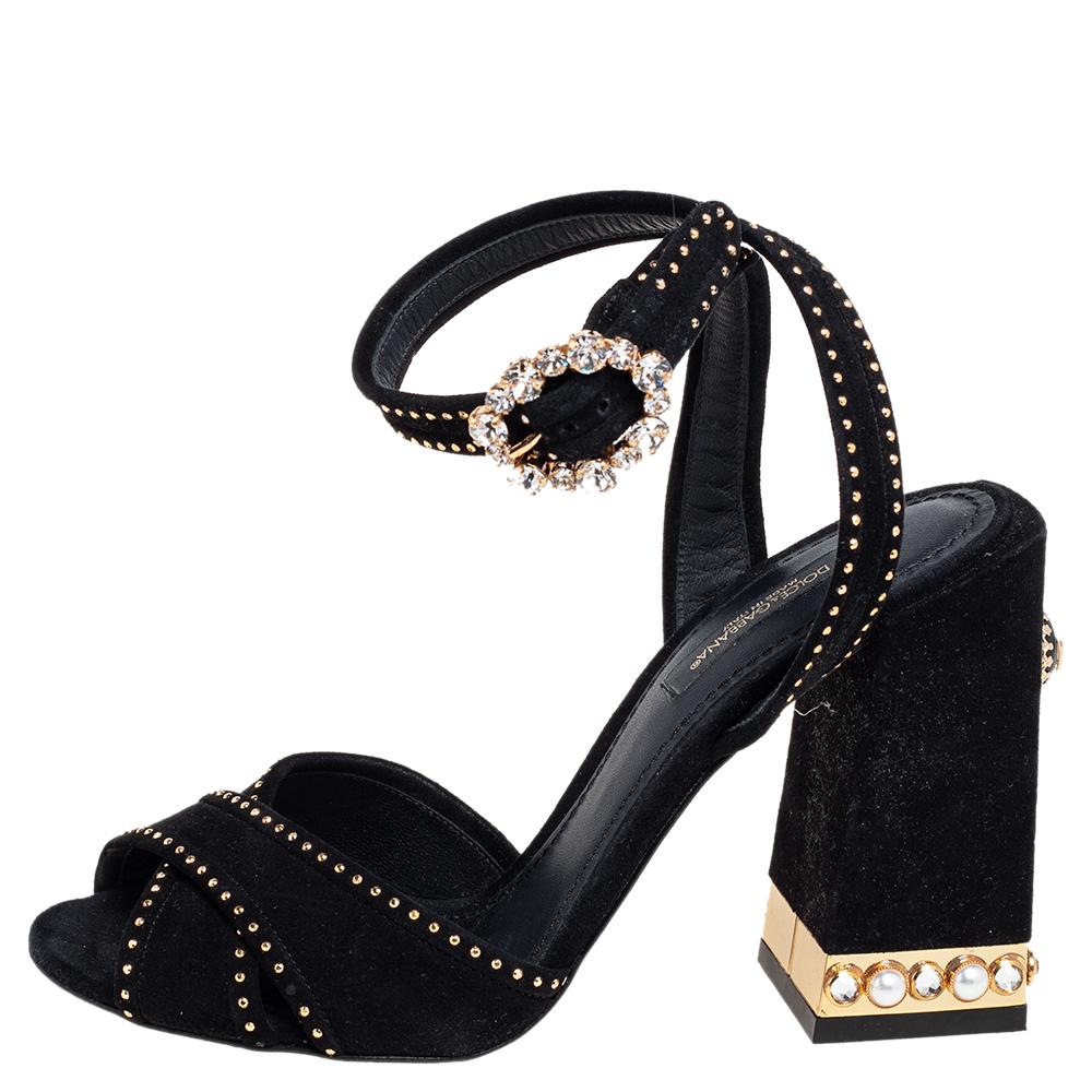 Get ready to dance all night long in these fabulous sandals from Dolce & Gabbana! The black sandals are crafted from suede and feature an open toe silhouette. They have been exquisitely embellished with crystal and pearls and flaunt cross straps on