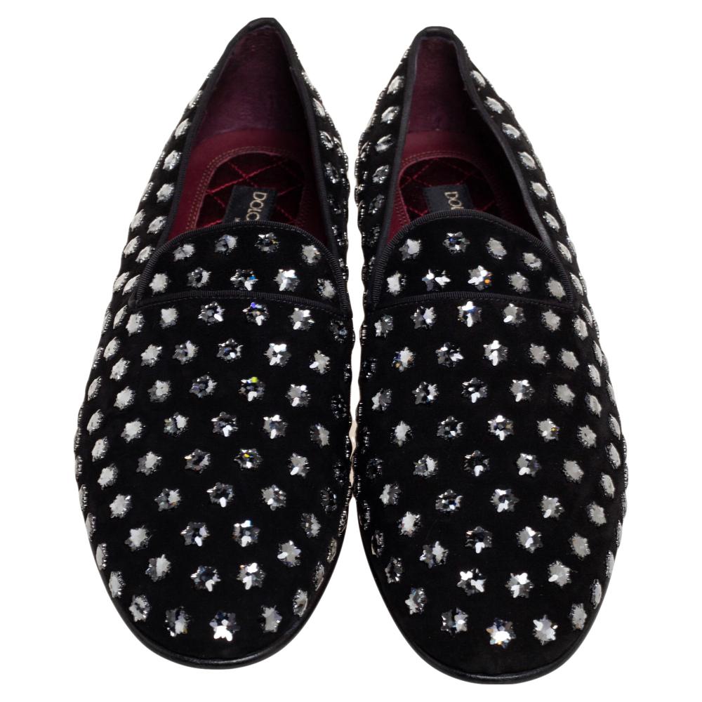 Add these glamorous Dolce & Gabbana loafers to your wardrobe and look ultra-fashionable on all your evening outings. Keep it minimal yet classy with these black shoes, made from suede and embellished with crystal stars all over.

Includes: Original