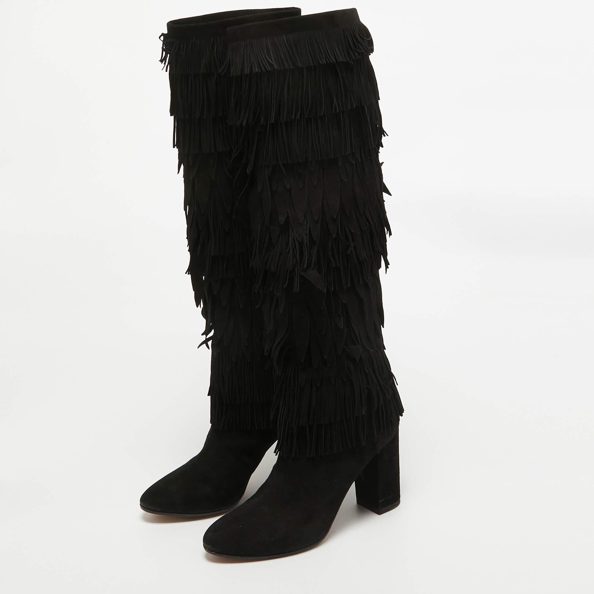 Dolce and Gabbana boots that you can wear with dresses skirts or with a simple T shirt and jeans. They have been crafted from quality suede in Italy and styled with block heels and fringes.