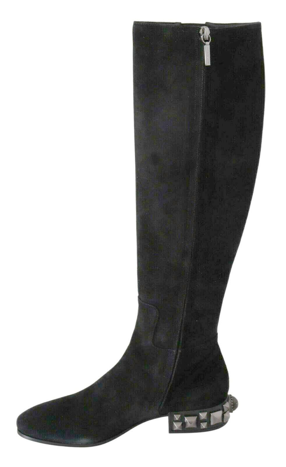 Gorgeous brand new with tags, 100% Authentic Dolce & Gabbana knee high boots crafted suede leather with embellishment on the soles.

Model: Knee high flat heels boots

Color: Black 
Material: 100% Suede

Sole: Rubber and leather
Stretch band on the
