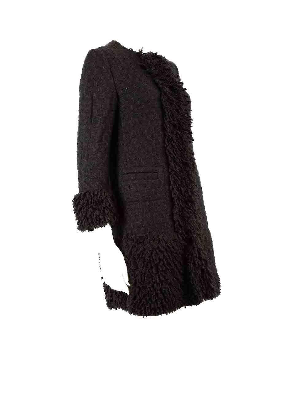 CONDITION is Very good. Minimal wear to coat is evident. Minimal wear to overall coat with slight pilling seen on this used Dolce & Gabbana designer resale item.
 
 
 
 Details
 
 
 Black
 
 Tweed
 
 Mid length coat
 
 Tassel trimmed
 
 Front snap