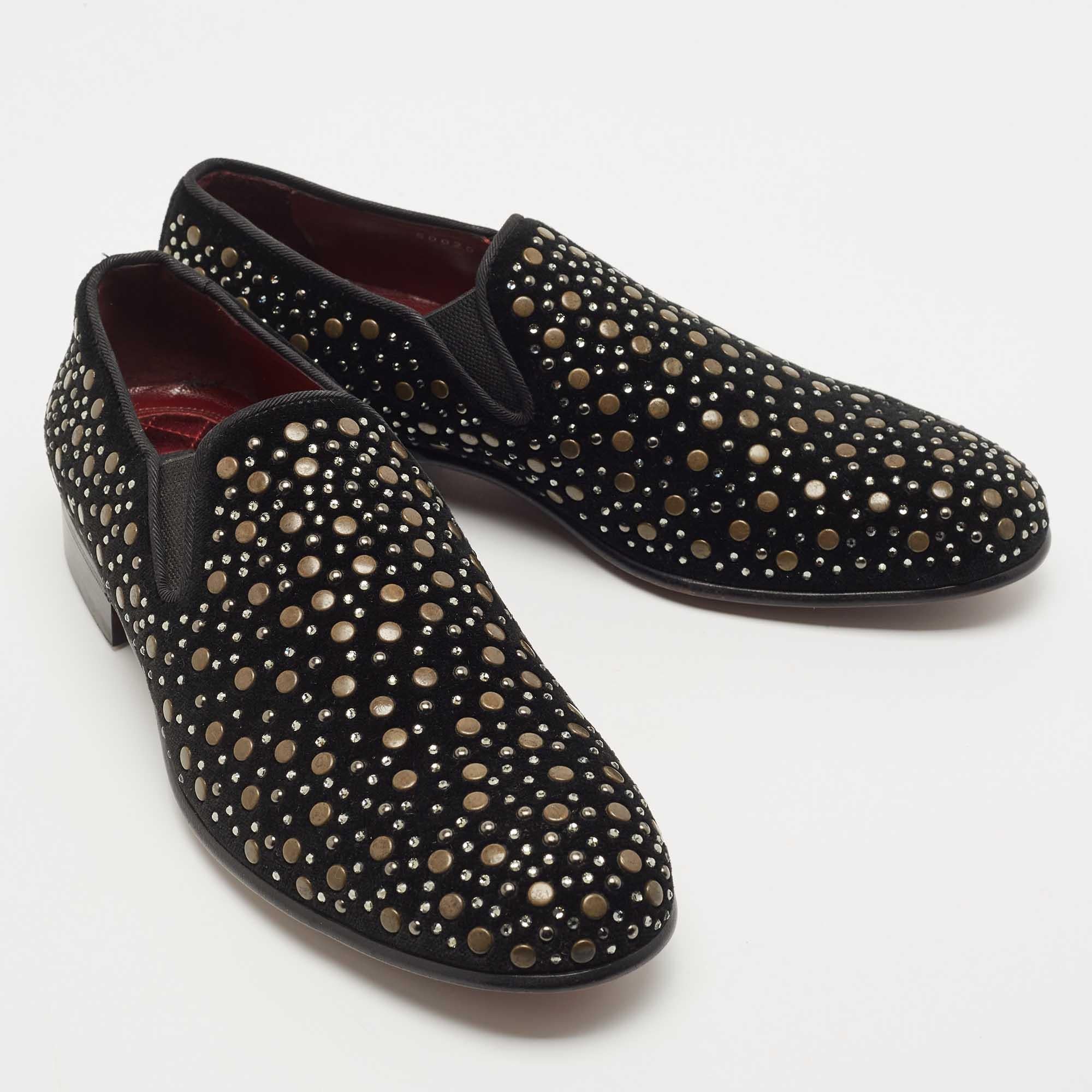 Add a pinch of jazz to those muted outfits of yours with these glamorous loafers from the house of Dolce & Gabbana. Embodying the spirit of the label in the truest form, these black velvet shoes are punctuated with gold-tone studs and crystals all