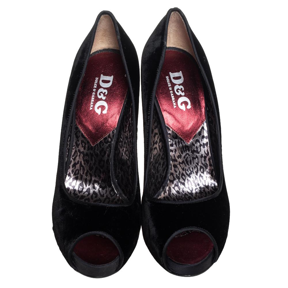 These pumps from Dolce & Gabbana are meant for seasons of comfort and style. Crafted from velvet, they feature classic details, peep-toes and 11.5 cm heels meant to elevate you with ease. The black pumps are a must-have.

Includes: Original Dustbag