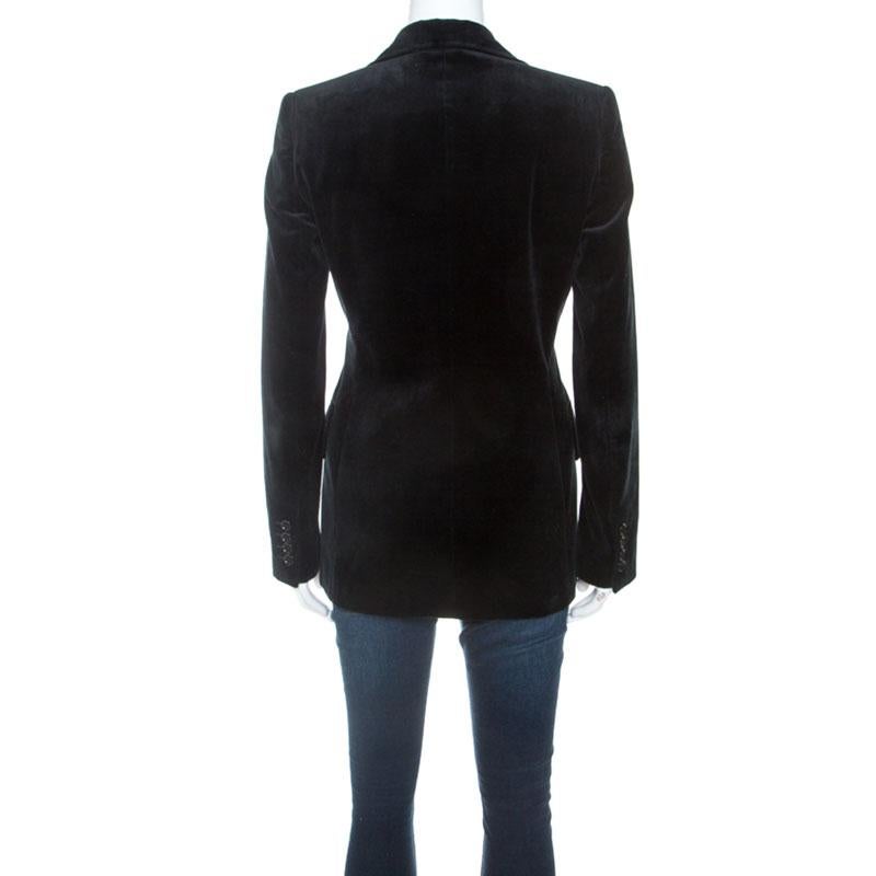 It won our hearts and will yours too for this black Dolce & Gabbana blazer is all about elegance and feminity! It is made from cotton and features velvet finish all over. It also flaunts a velcro strap fastening at the front for some extra