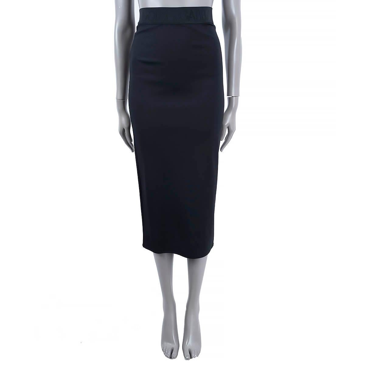 100% authentic Dolce & Gabbana pencil midi skirt in black viscose (75%), polyamide (18%) and elastane (7%). Features an elastic logo waistband and high waist, mid-length pencil silhouette. Closes with a concealed zipper in the back. Unlined. Brand
