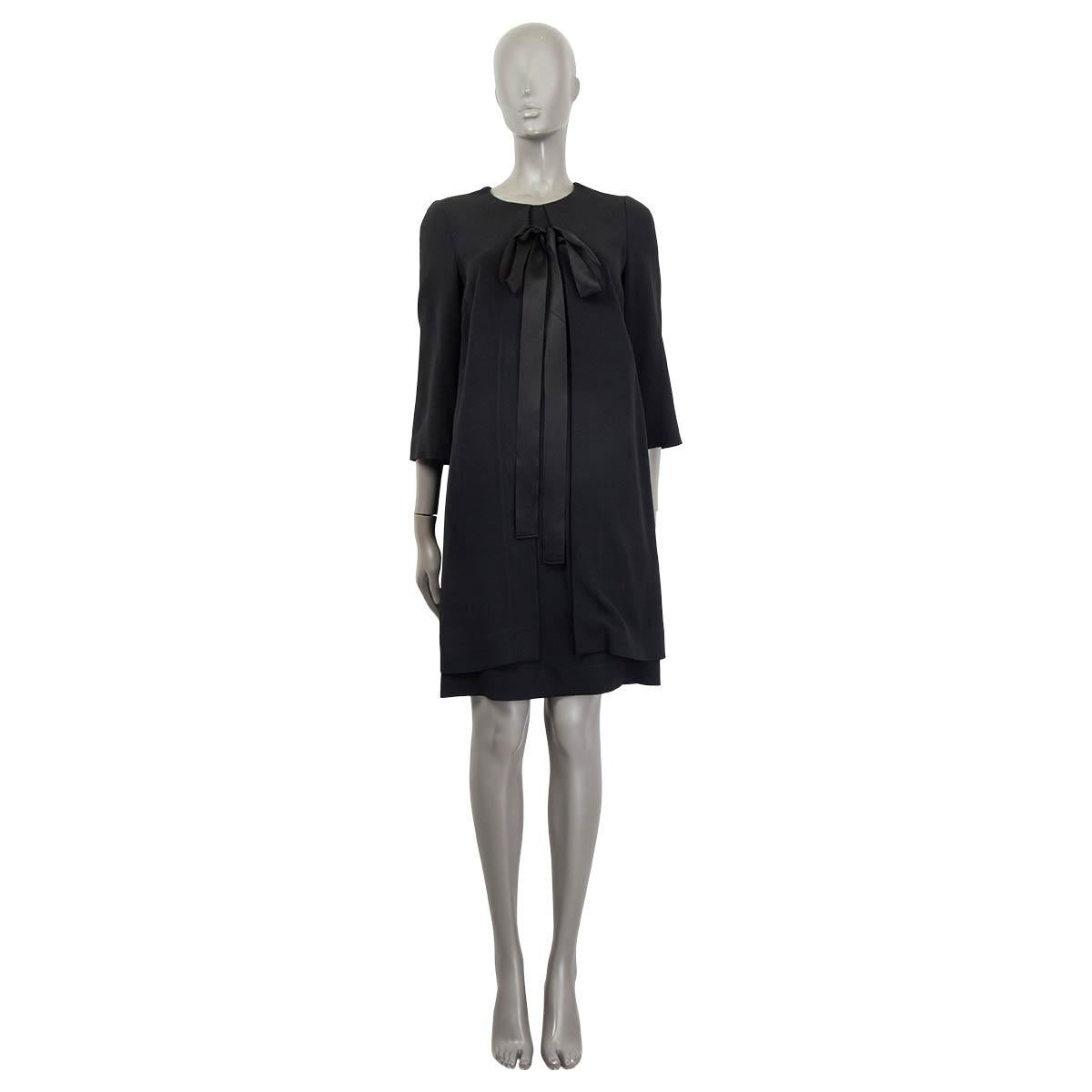 100% authentic Dolce & Gabbana panelled dress in black viscose (46%), acetate (41%), silk (10%) and elastane (3%). Features 3/4 sleeves and a bow at the neck. Opens with a concealed zipper and a hook at the back. Lined in black and white polyester