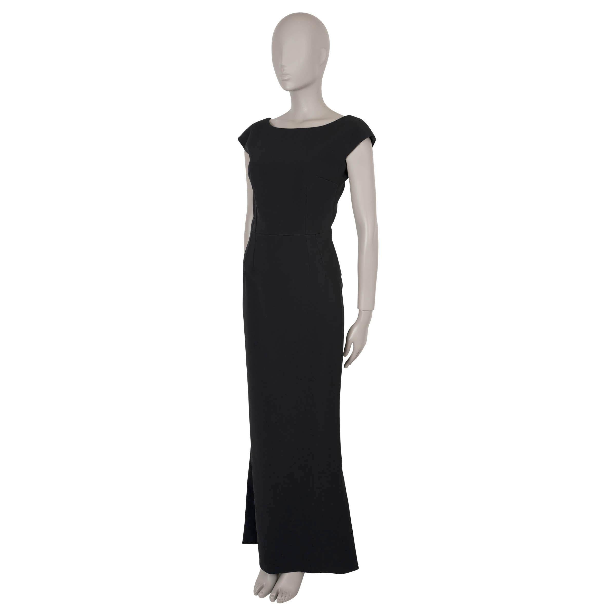 This 100% authentic Dolce & Gabbana long, sleeveless evening dress exudes elegance in black acetate and viscose with a tailored silhouette. The dress features a hidden back zipper and a black silk underskirt with lace detailing at the hem, creating