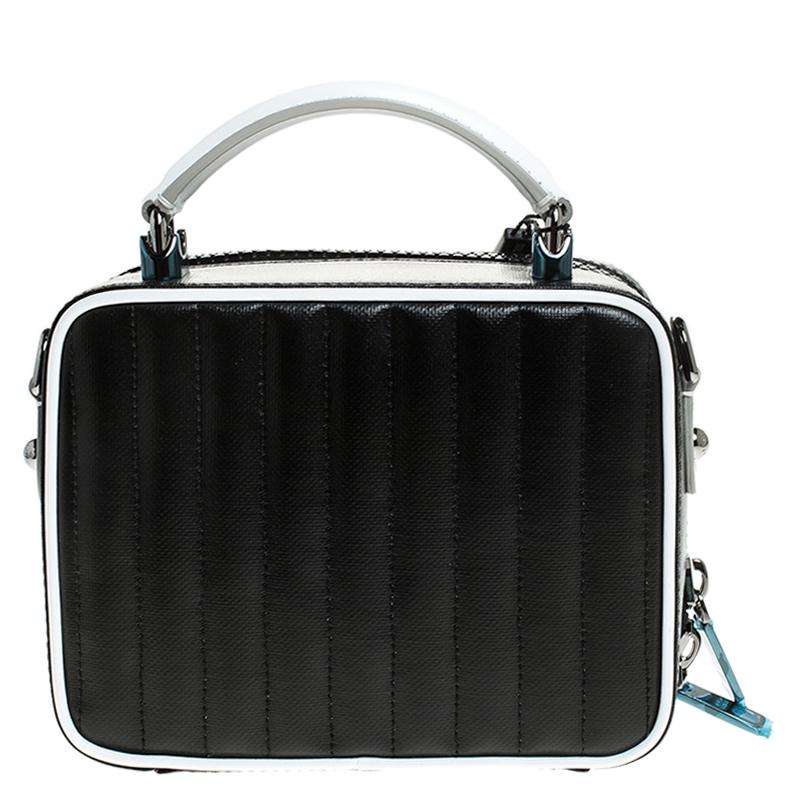 This DG Girls bag from Dolce & Gabbana is here to end all your fashion woes, as it is striking in appeal and utterly high on style. It has been crafted from black and white DG coated canvas. The insides are lined with fabric and the bag is complete