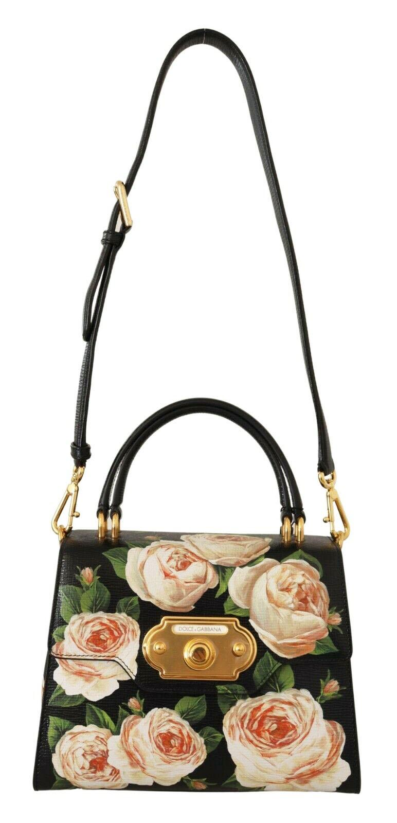 Gorgeous brand new with tags, 100% Authentic Dolce & Gabbana black Welcome bag, crafted in glossy embossed leather with colorful floral prints. The gilded lock, made in the shape of an old door lock, fully justifies the name of an elegant