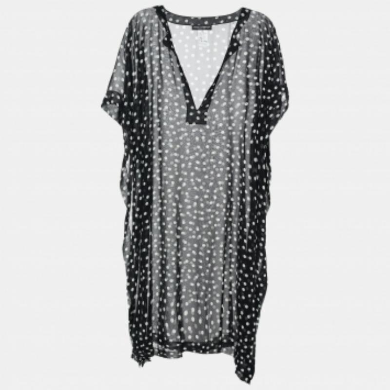 Sentiti comodo, elegante e rilassato con questo top della Maison Dolce & Gabbana. Caratterizzato da una silhouette oversize, questo top è disegnato in tessuto georgette stampato a pois bianchi e neri. Ha una scollatura a V. Abbina questo top a
