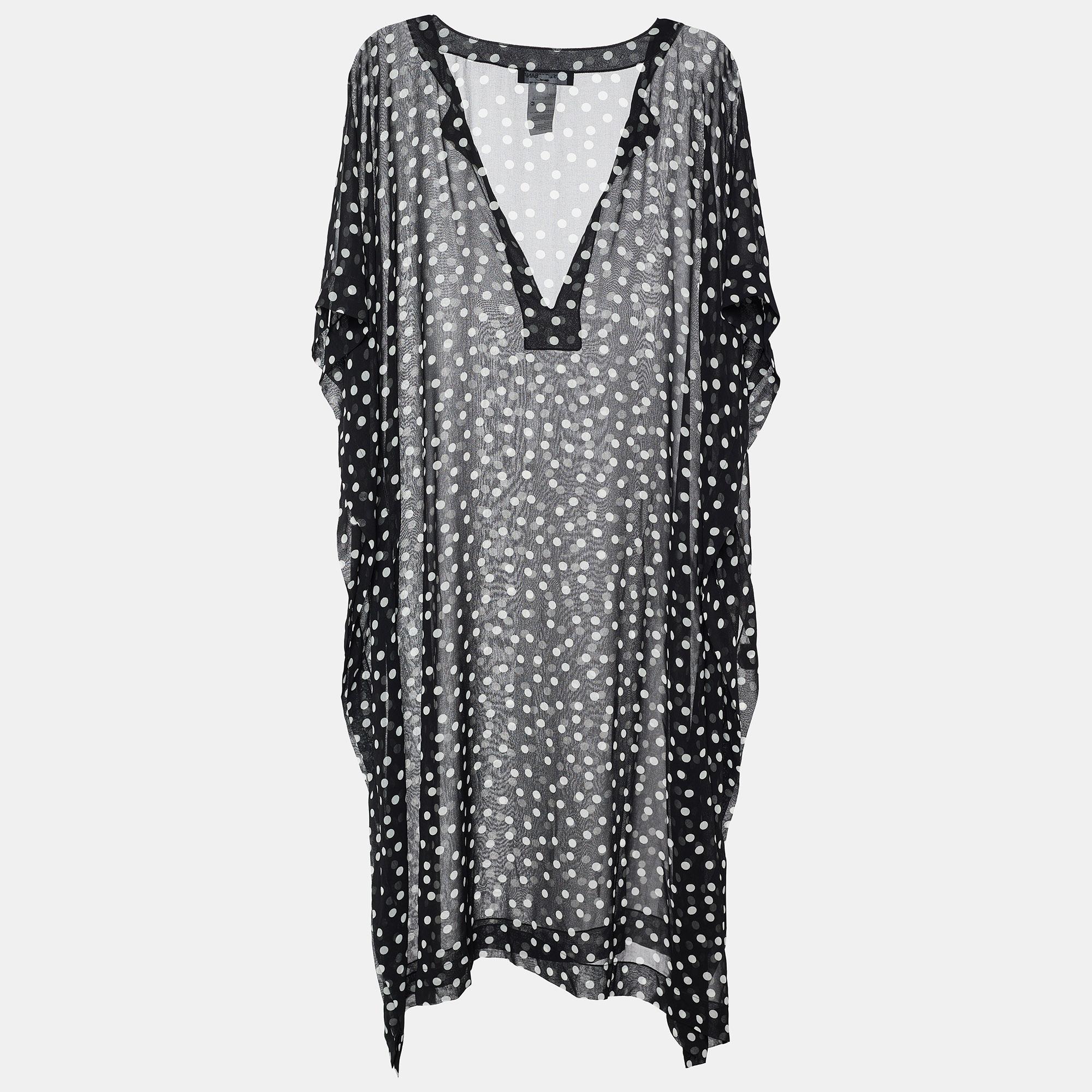 Feel comfortable, stylish, and relaxed in this top from the House of Dolce & Gabbana. Displaying an oversized-fit silhouette, this top is designed using white-black polka-dot printed georgette fabric. It has a V-shaped neckline. Style this top with