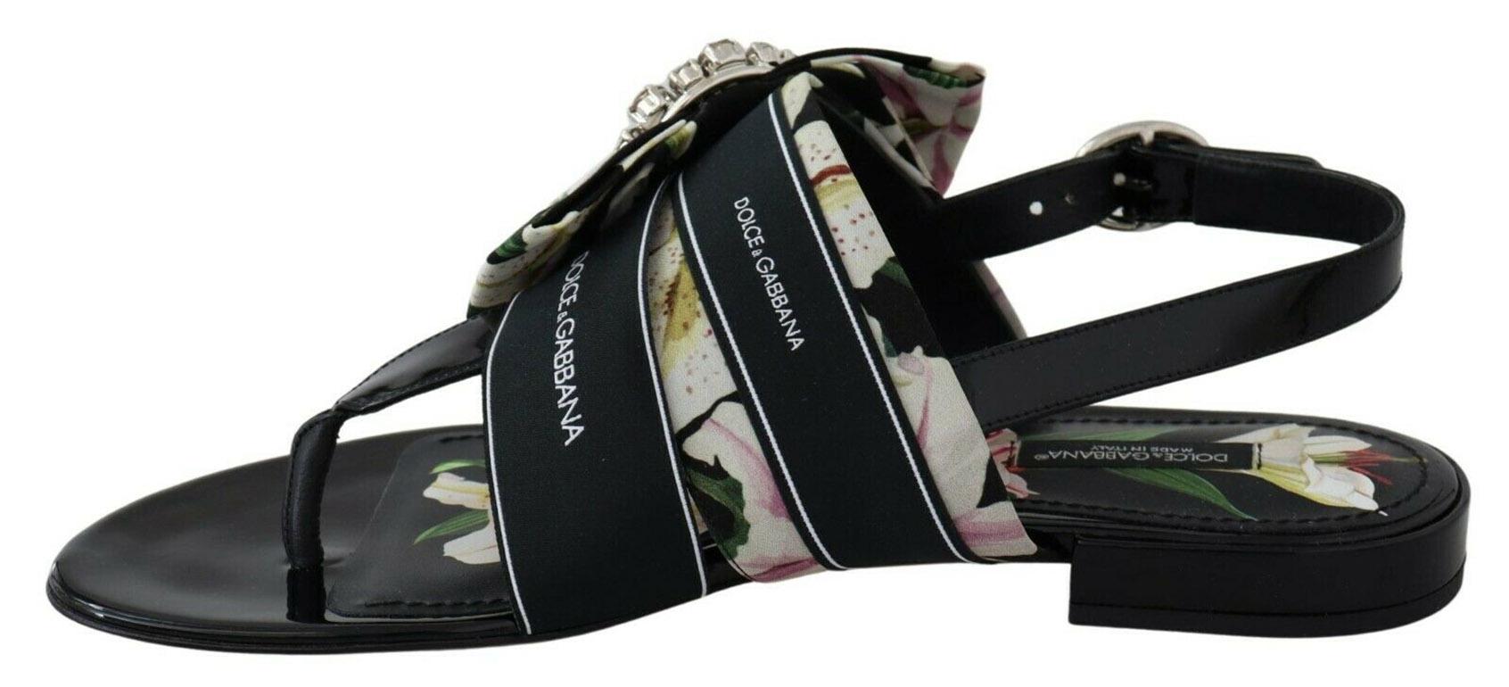 Gorgeous, brand new with tags

100% Authentic Dolce & Gabbana floral printed cady thong
sandals detailed with jewel buckle and
printed insole.

Model: Sandals flip flops heel strap
Flats
Color: Black with floral print
Material: 58% Silk 30%
