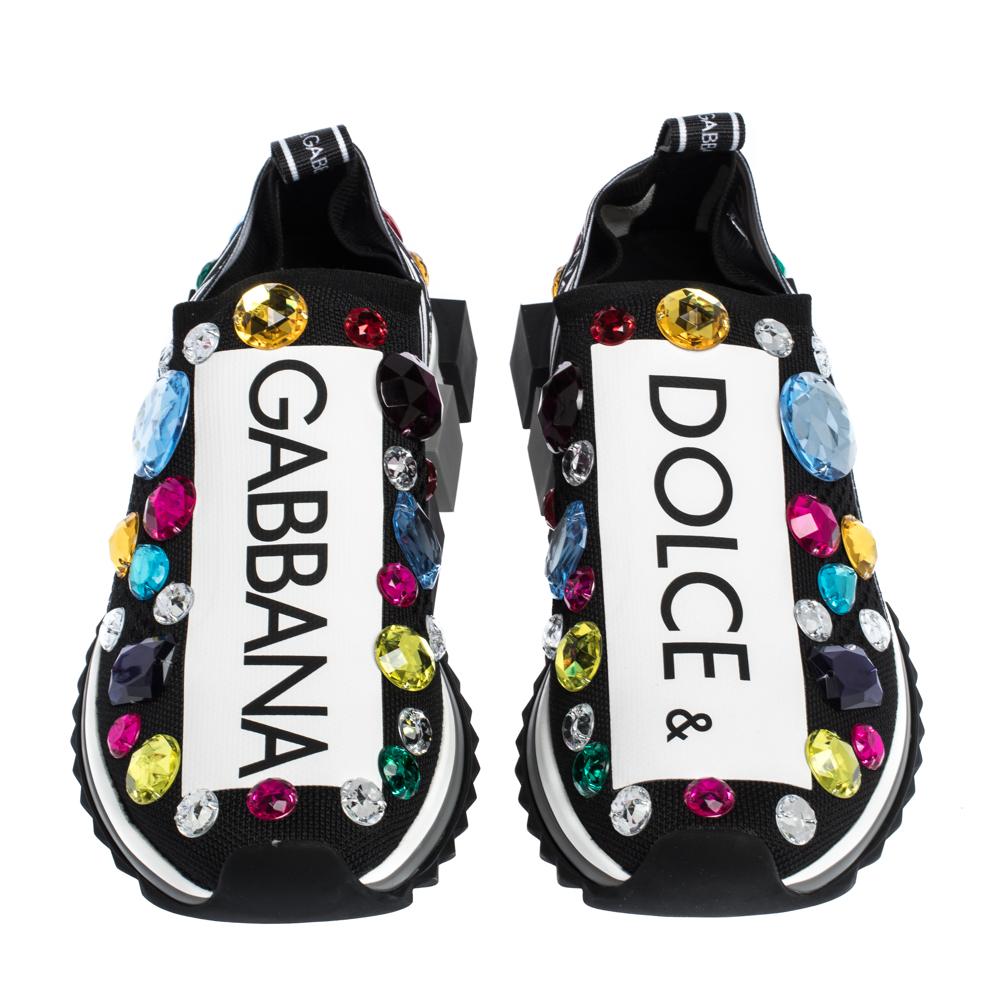 Add sparkle to your look with these delightful Dolce & Gabbana slip-on sneakers. Characterized by crystal embellishments, these black and white sneakers will give you a major makeover. Crafted from stretch jersey fabric, these sneakers make a fun,