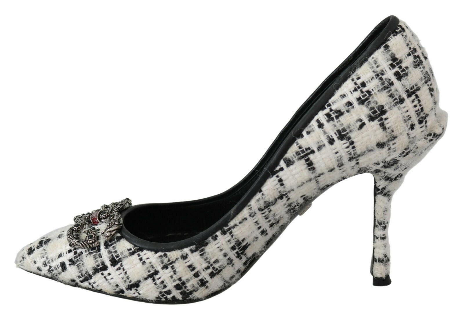 Gorgeous pre-owned with tags, 100% Authentic Dolce & Gabbana Black/white logo-embellished tweed pumps featuring logo plaque, kitten heel, branded insole and tweed.

Model: Pumps

Material: Tweed, Leather

Color: Black, White

Leather inner and outer