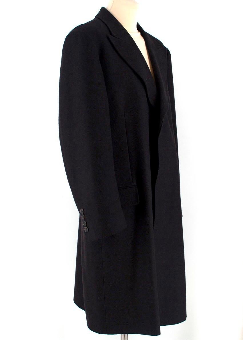 Dolce & Gabbana Black Wool and Cashmere Coat

-Black wool overcoat
-Three front pockets
-Two interior pockets
-Shoulder pads
-Tortoiseshell button closure
-Harringbone wool and cashmere felt
- Wool and Cashmere
Please note, these items are pre-owned