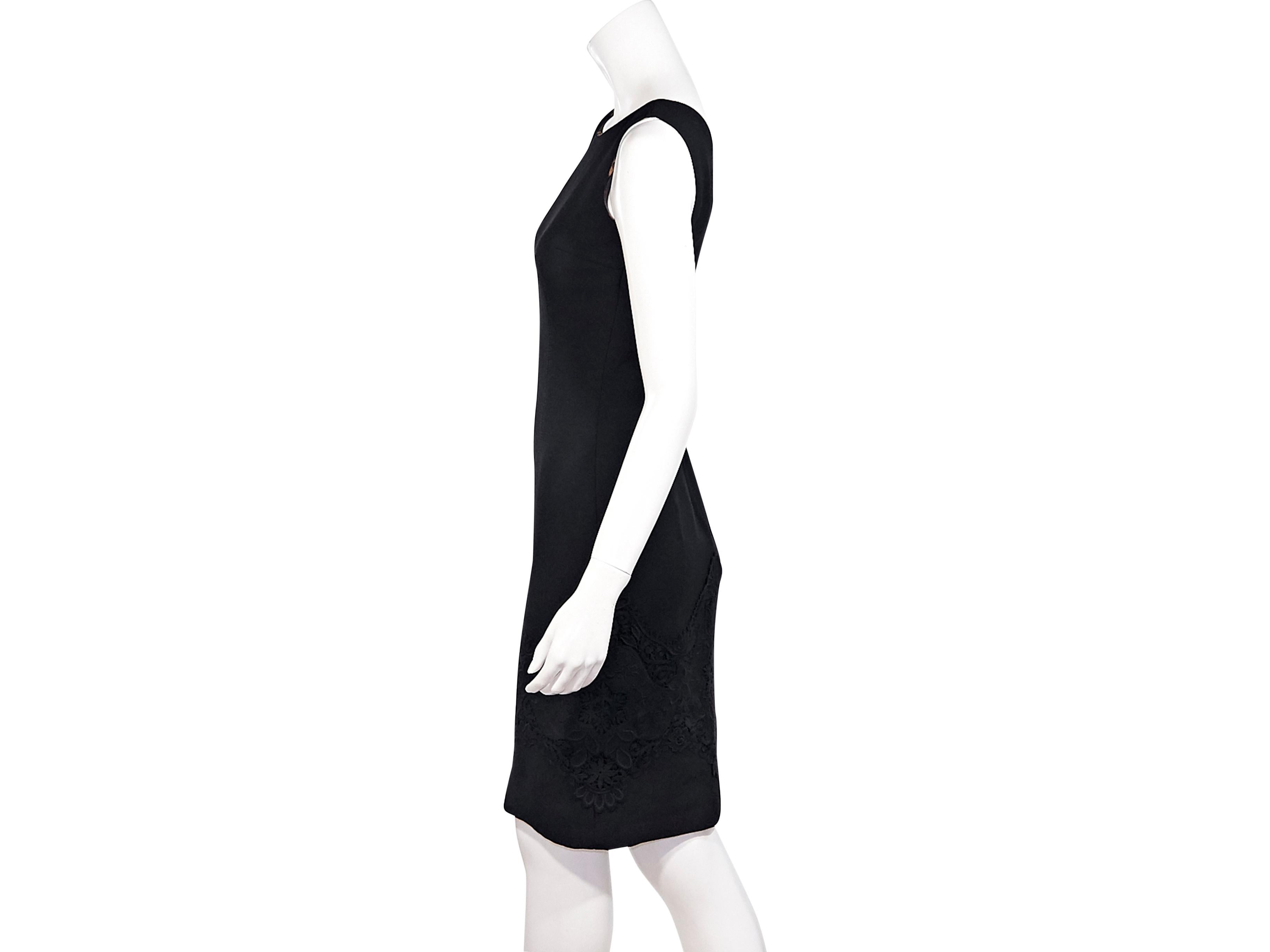Product details:  Black wool-blend sheath dress by Dolce & Gabbana.  Boatneck.  Sleeveless.  V-back.  Concealed back zip closure.  Lace trims skirting.  32