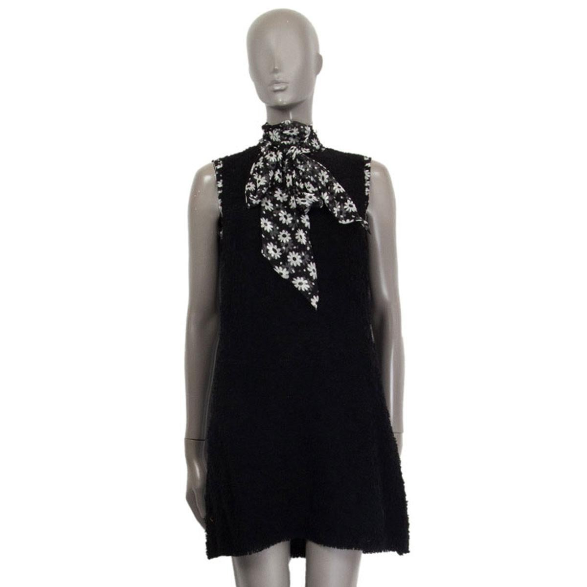 authentic Dolce & Gabbana bouclé dress in black wool (66%) silk (20%) and polyamide (14%) with a black&white floral print silk (100%) scarf to bind around the neck and at the armhole hem. Closes with a zipper on the back. Lined in black polyester