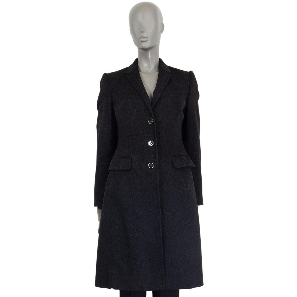 Dolce & Gabbana classic coat in black virgin wool (90%) and cashmere (10%) with narrow notch collar, one decorative chest pocket and two decorative flap pockets. Closes on the front with buttons. Lined in acetate (78%), nylon (16%) and elastane