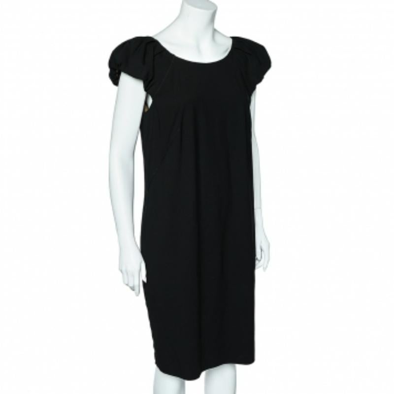 Exude sheer grace in this Dolce & Gabbana midi dress. Tailored from quality fabrics,  the design is detailed with pleated sleeves and a back zipper closure. Pair it with your favorite heels for an effortlessly stylish look.