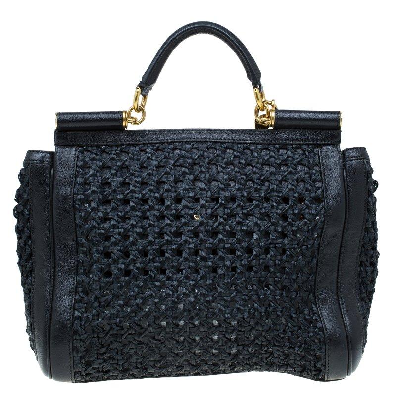 This classic masterpiece from Dolce and Gabbana is perfect to flaunt around at your parties. Crafted from raffia, this Miss Sicily bag is accented with gold-tone detailing. It features the signature structured Sicily top with single handle, and a
