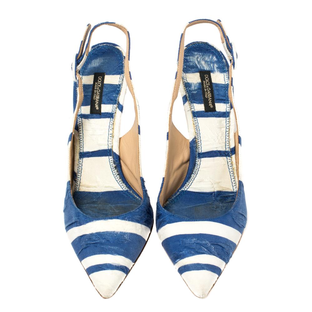 Treat your feet to this gorgeous pair of sandals from Dolce & Gabbana. Crafted from striped brocade fabric, this pair features pointed toes, sleek 11 cm heels, and buckle slingbacks. The insoles are lined with leather to offer maximum ease.

