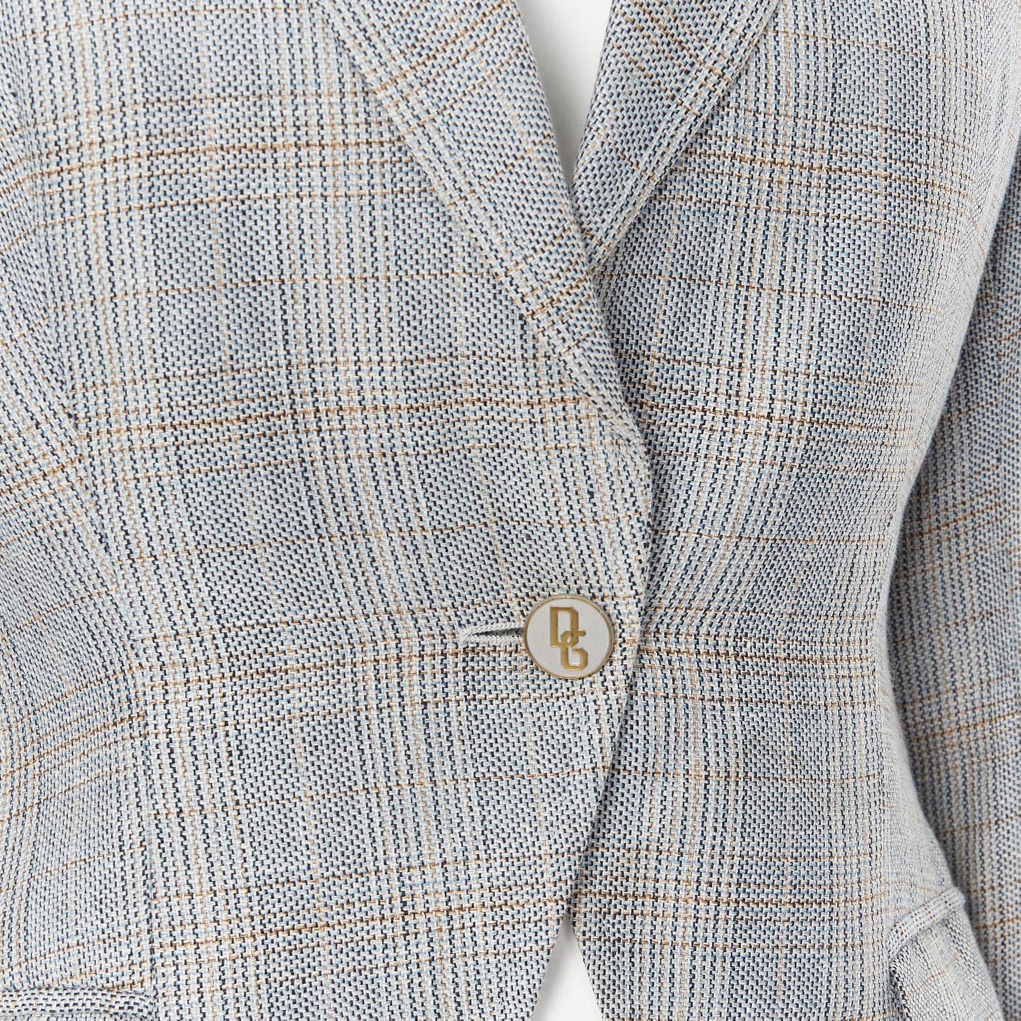 DOLCE GABBANA blue check wool tweed one button cutaway blazer pant suit IT42 M 
Reference: GIYG/A00048 
Brand: Dolce Gabbana 
Material: Wool 
Color: Grey 
Pattern: Solid 
Closure: Button 
Extra Detail: This blazer comes with the complimentary