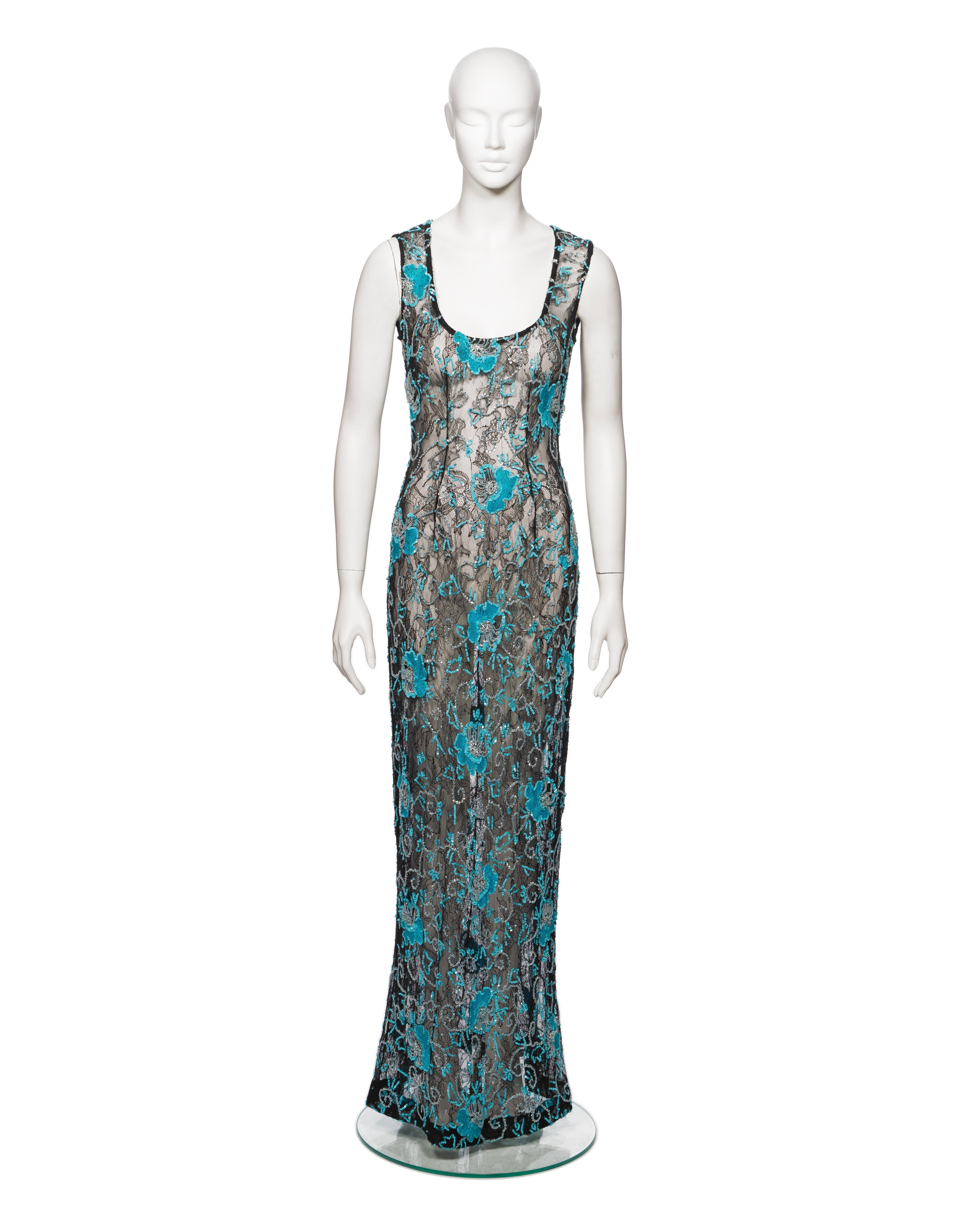 ▪ Brand: Dolce & Gabbana 
▪ Creative Director: Domenico Dolce and Stefano Gabbana
▪ Collection: Fall-Winter 1999
▪ Sold by: One of a Kind Archive
▪ Fabric: Black Lace
▪ Details: Blue floral embroidery and embellishments
▪ Size: Approx. IT40 - FR36 -