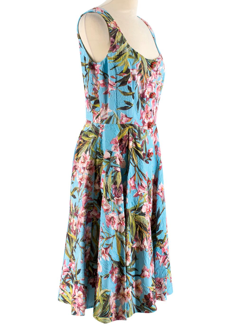 Dolce & Gabbana Blue Floral Sleeveless Dress

- Large embellished buttons
- Lined corset
- Zip rear fastening
- Pleated skirt 

Made in Italy 

Dry clean only 

Measurements are taken with the item lying flat, seam to seam.
Shoulder to Shoulder: