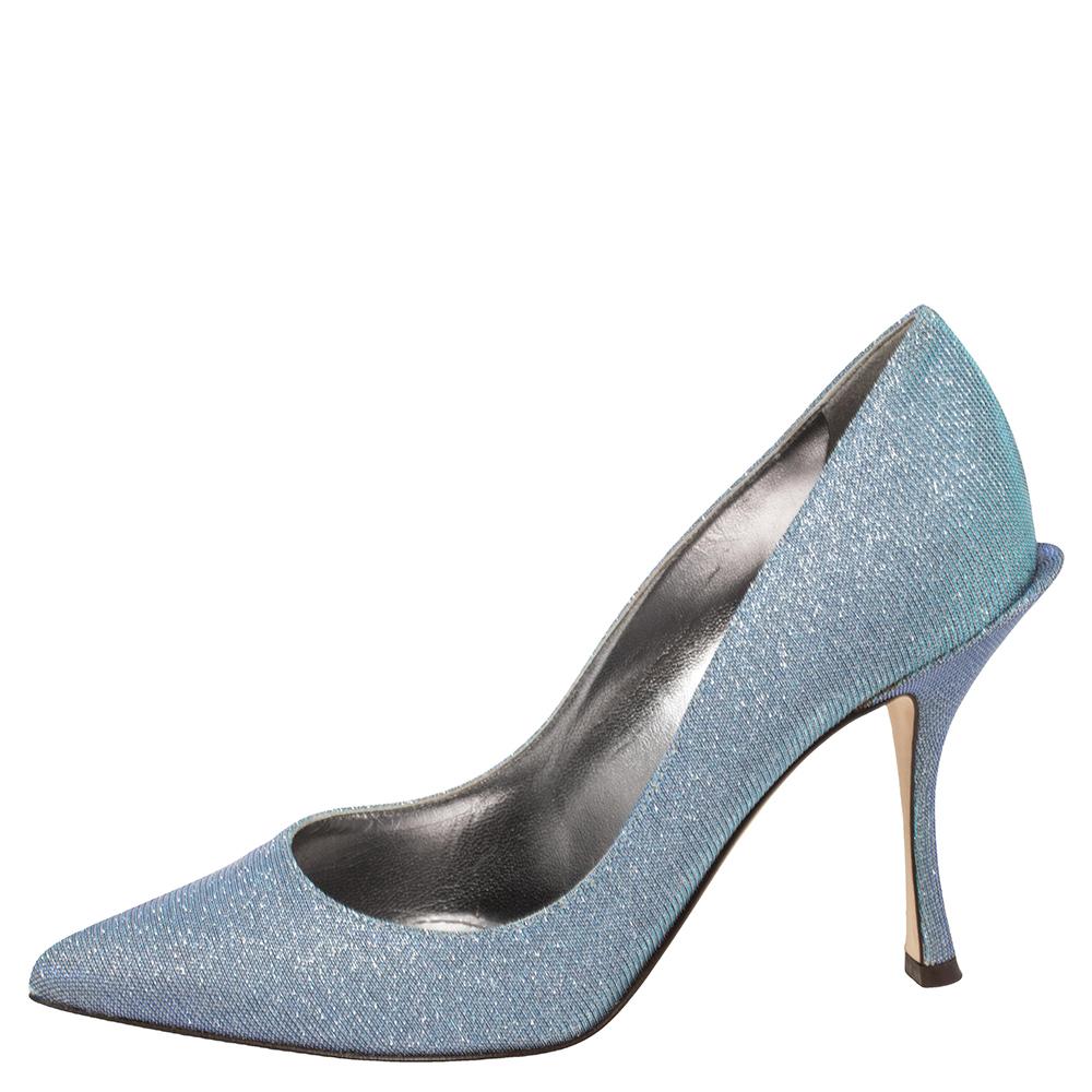 Walk with panache in these splendid blue pumps from Dolce & Gabbana. They are crafted from glitter and styled with pointed toes. They come endowed with comfortable leather insoles and elevated on 9 cm heels.

Includes: Original Box, Original Dustbag