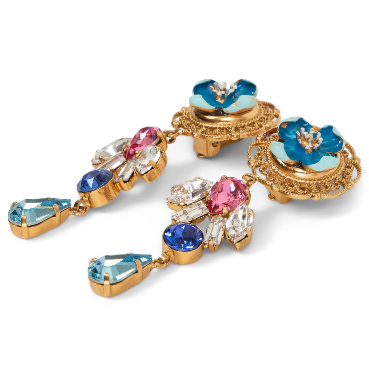 100% authentic Dolce & Gabbana Flower & Crystal drop clip-on earrings with light blue, blue, pink and clear rhinestones and a blue resin flower featuring gold-tone brass filigree. Have been worn and are in excellent condition.
