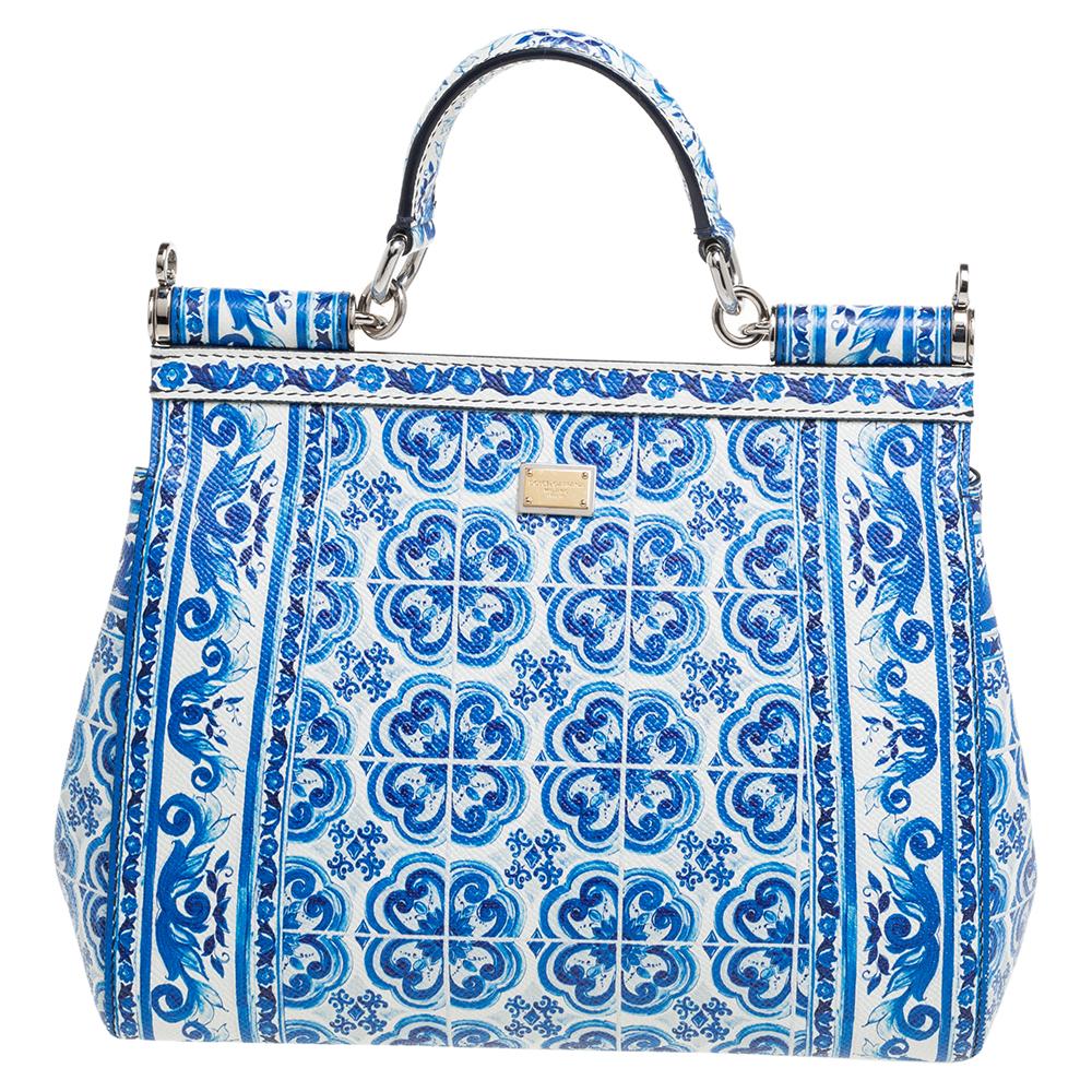 This exquisite Dolce & Gabbana Miss Sicily bag spells “take me to Italy”! The extraordinary print inspired by traditional Italian ceramics strikes with its rich hues and unparalleled intricacy of the stunning motifs that reflect this label's