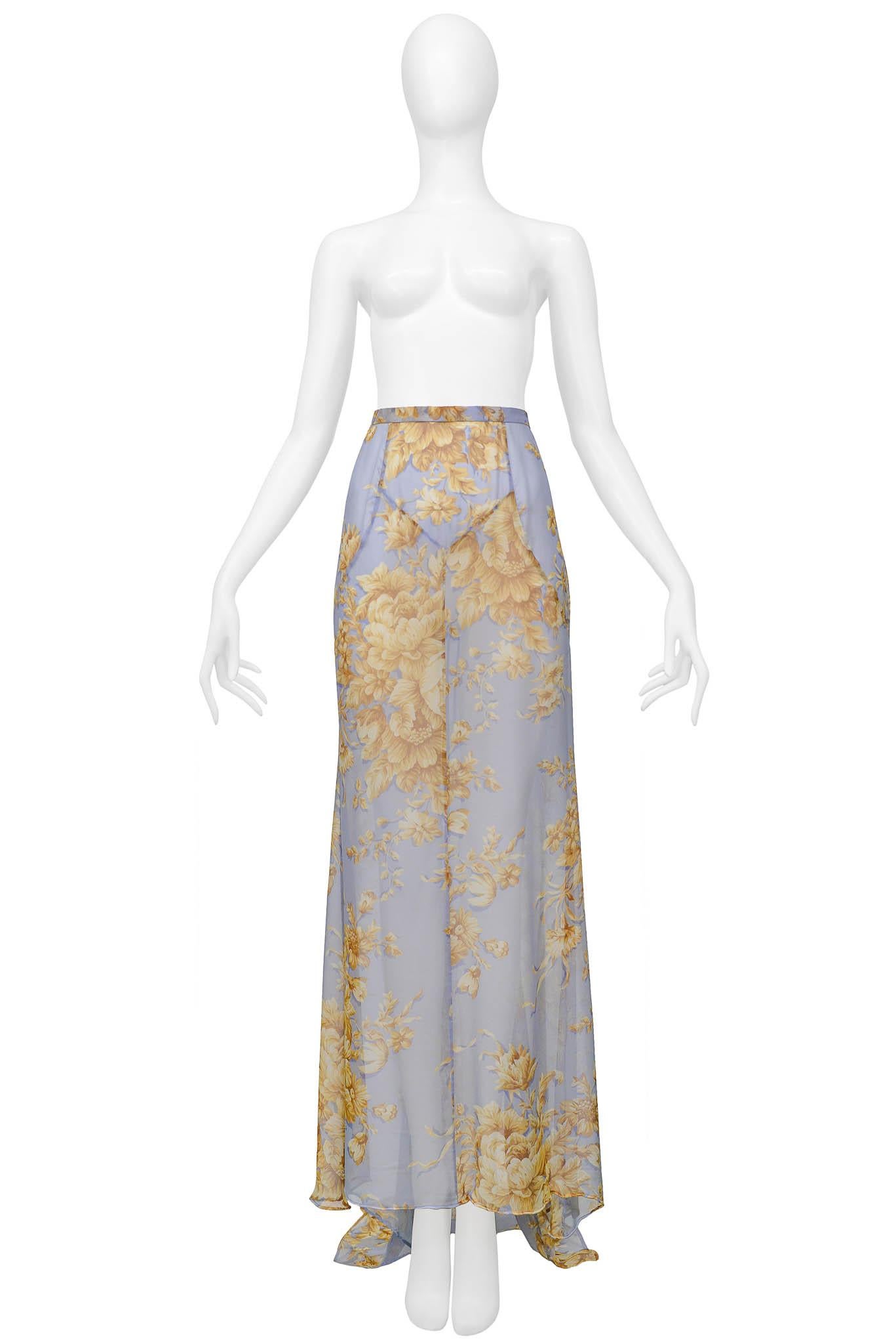 Resurrection Vintage is excited to offer a vintage Dolce & Gabbana blue maxi skirt featuring a tan flower pattern, a high-low hem, and an invisible zipper at the back. Minor Staining and a tiny hole along the hem of the skirt.

Dolce & Gabbana
Size