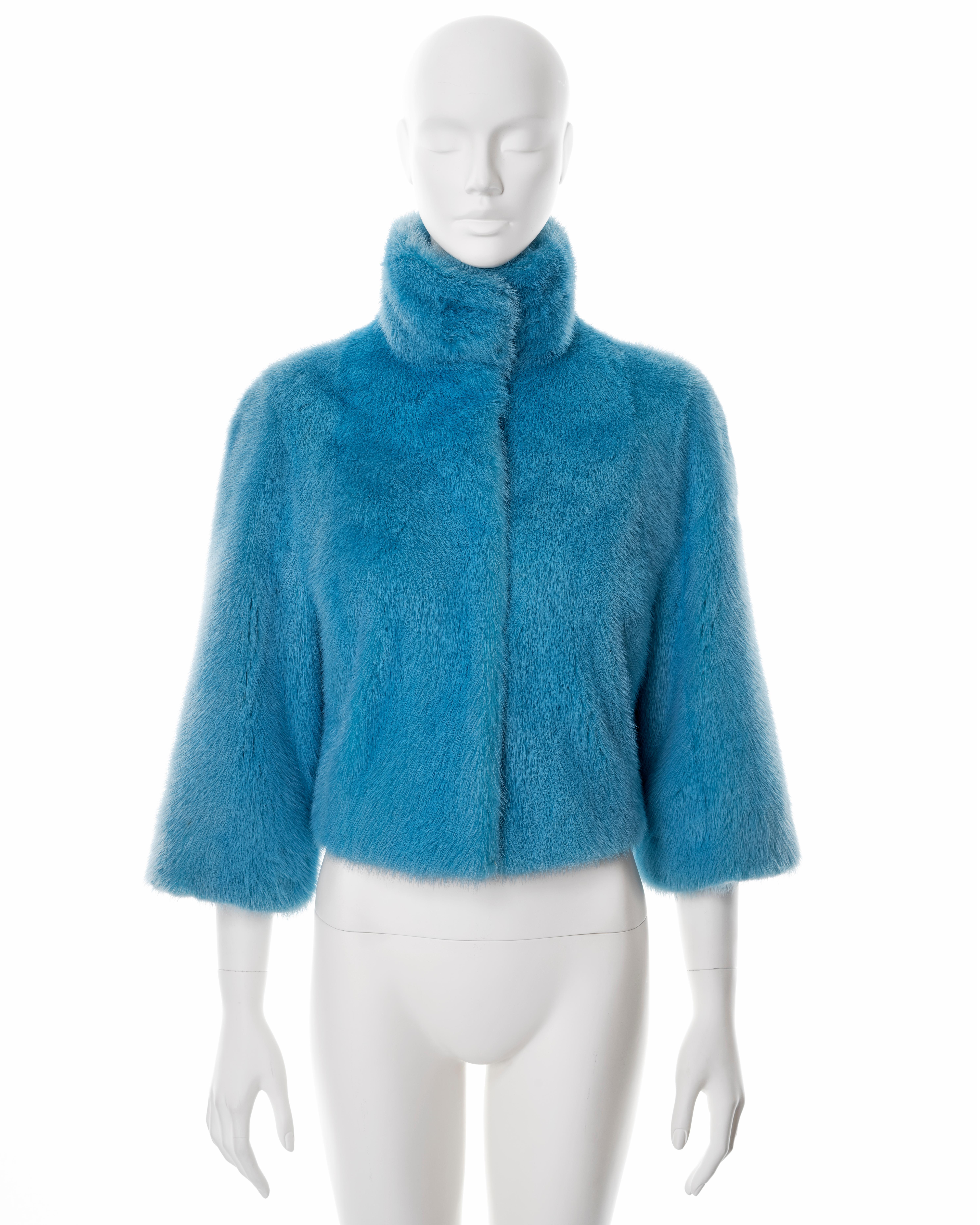 ▪ Dolce & Gabbana cropped fur jacket 
▪ Sold by One of a Kind Archive
▪ Fall-Winter 1999
▪ Constructed from blue-dyed mink fur 
▪ High standing collar 
▪ Press-stud buttons
▪ Cropped sleeves
▪ Black silk lining
▪ IT 44 - FR 40 - UK 12 - US 8
▪ Made