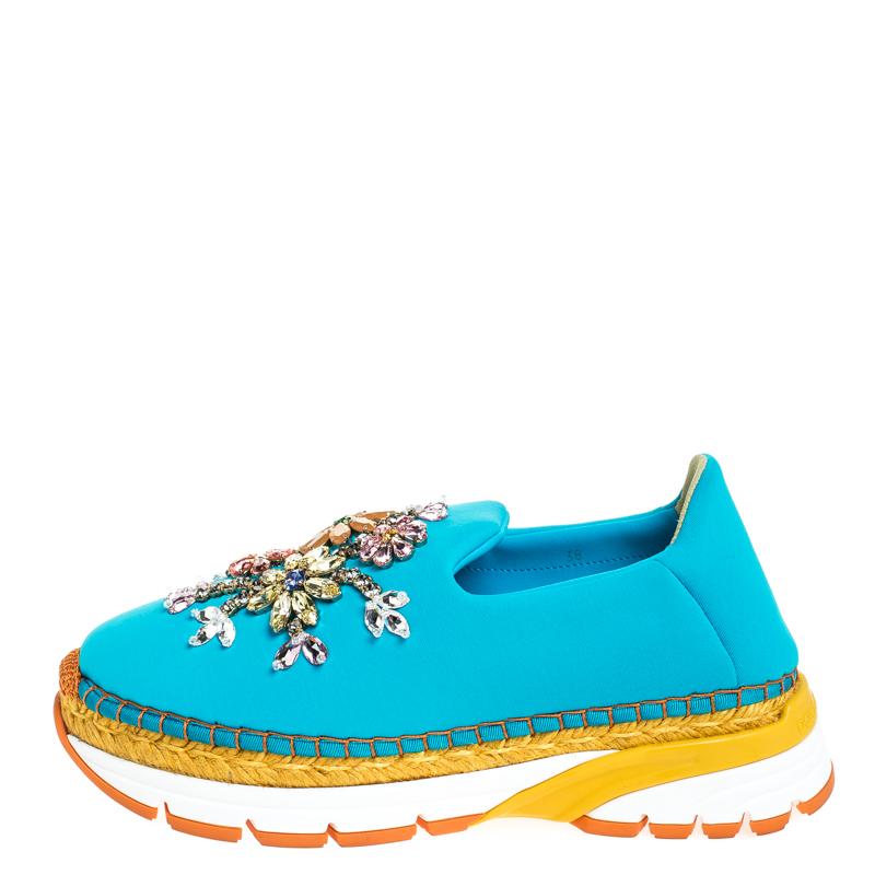 Fabulously designed to stand out and grab you compliments, these slip-on sneakers from Dolce & Gabbana deserve a special place in your wardrobe! Shining bright in blue, these sneakers are crafted from neoprene and feature round toes, exquisitely