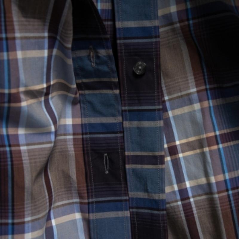 Shirts are an indispensable part of a man's wardrobe, so Dolce & Gabbana brings you a creation that is both versatile and stylish. It has been tailored from cotton in a blue shade. The shirt is detailed with a plaid checkered pattern and long