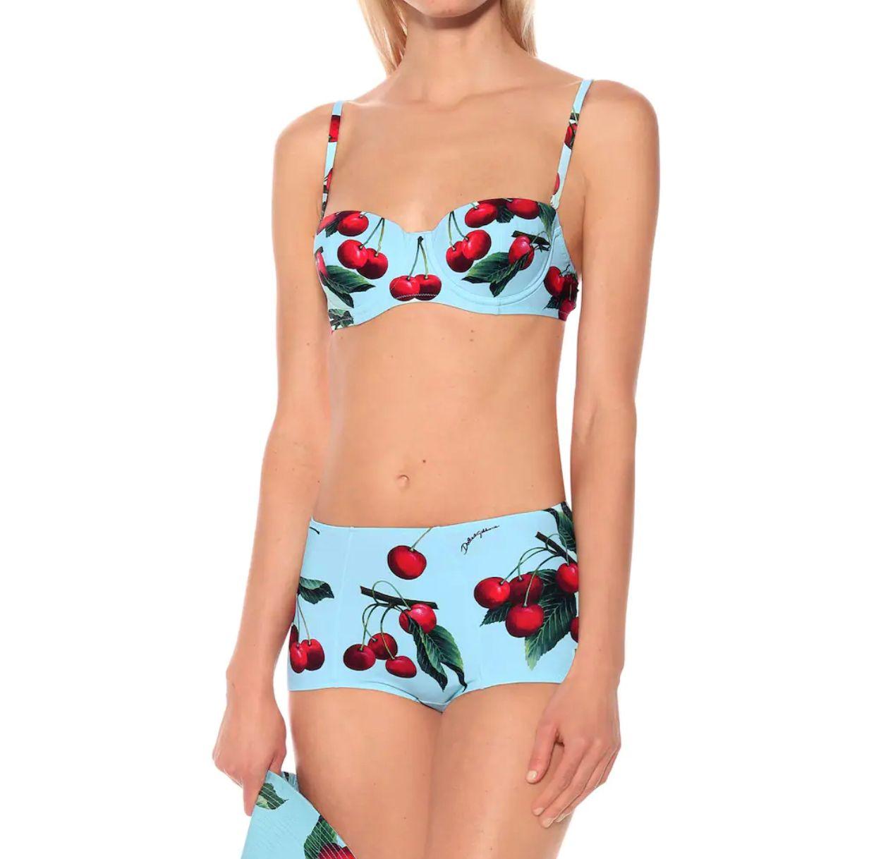 Dolce & Gabbana romantic built-in balcony bra bikini top offers a sophisticated look thanks to the CHERRY print and is made of the precious “sensitive fabric”. The shaped cups guarantee structure and support; 
The bikini bottom with high waistline