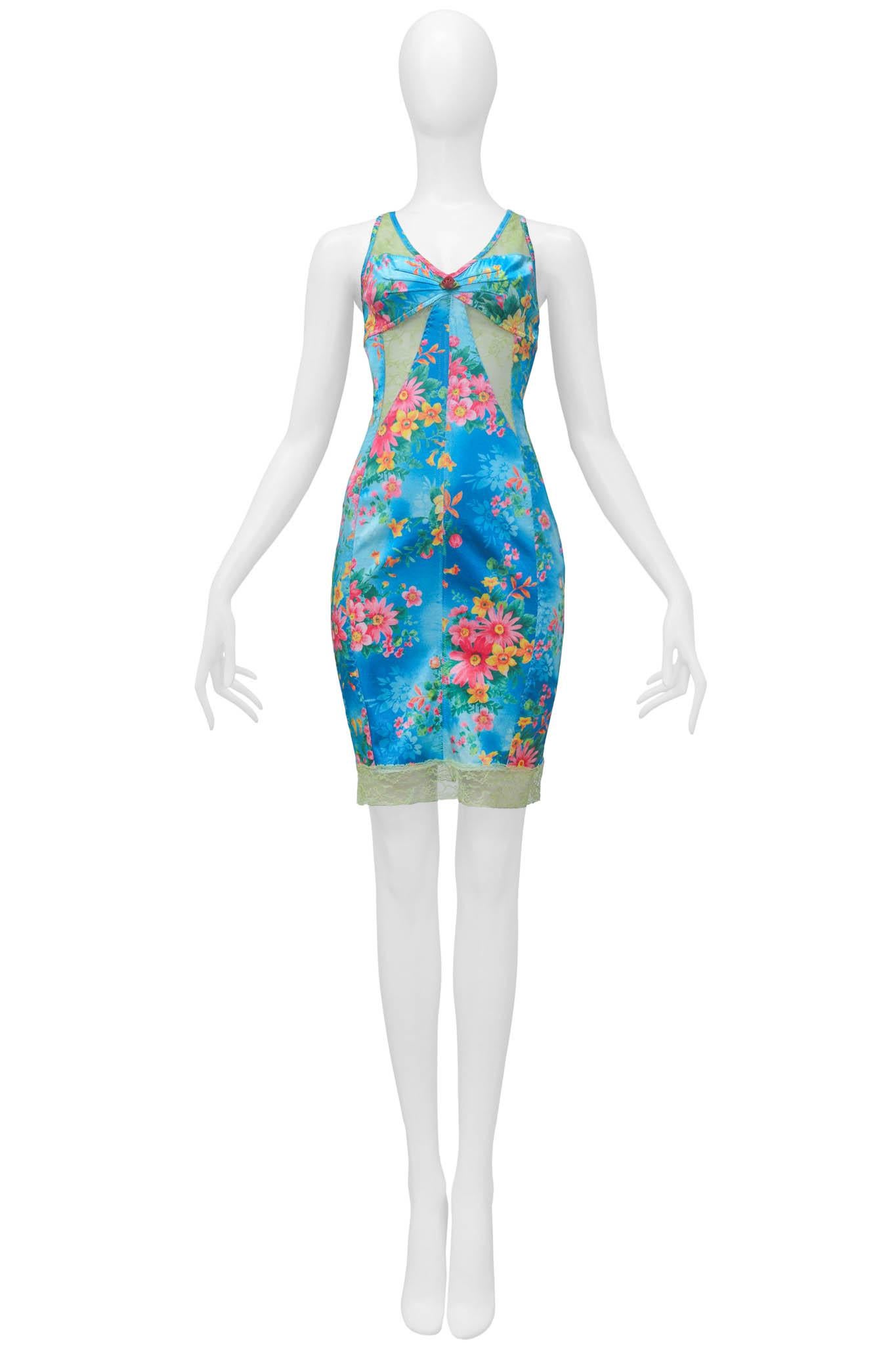 Resurrection Vintage is excited to present a vintage Dolce and Gabbana blue silk dress featuring pink flowers, scooped back, cutouts with lace insets, and lace trim at the hem of the dress.

D&G
Size: 40
Silk
Excellent Vintage Condition