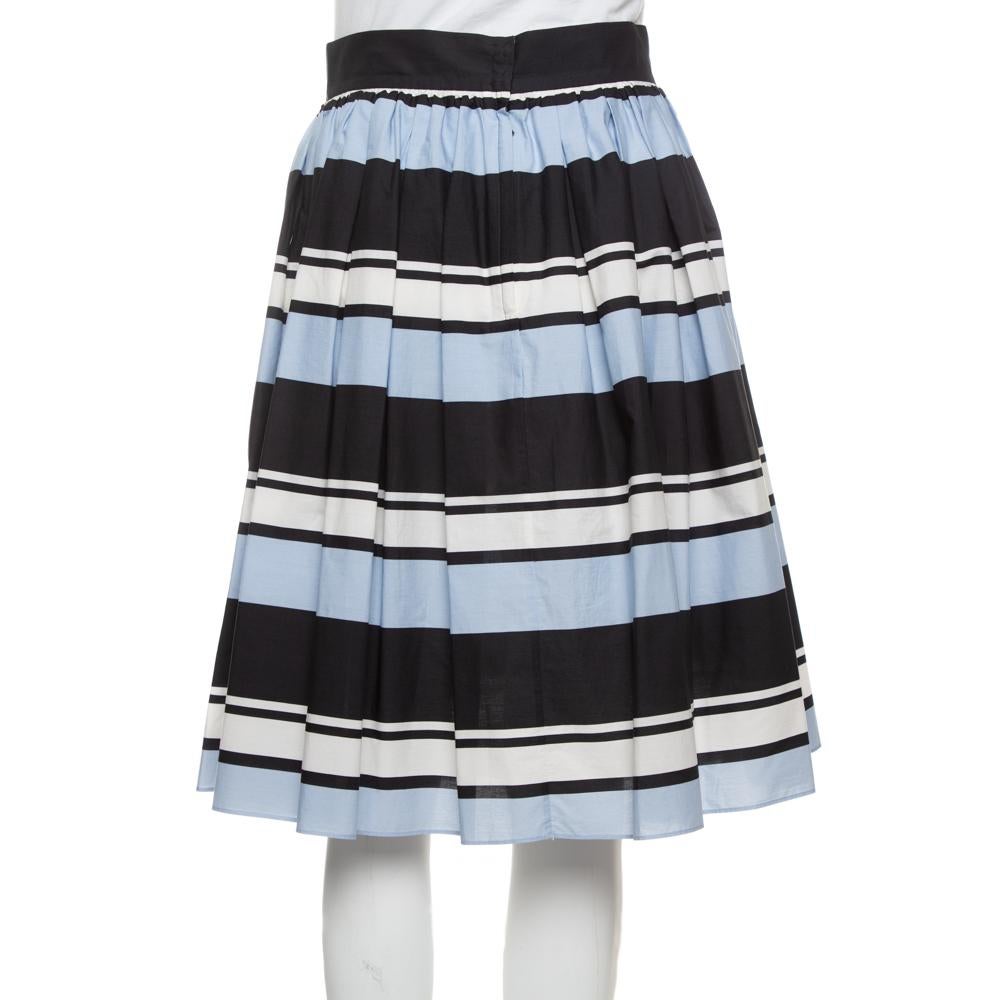 Team this gorgeous Dolce & Gabbana skirt with a tee and you are all set for a smart casual look. This stylish blue, striped skirt is the epitome of elegance and poise.

