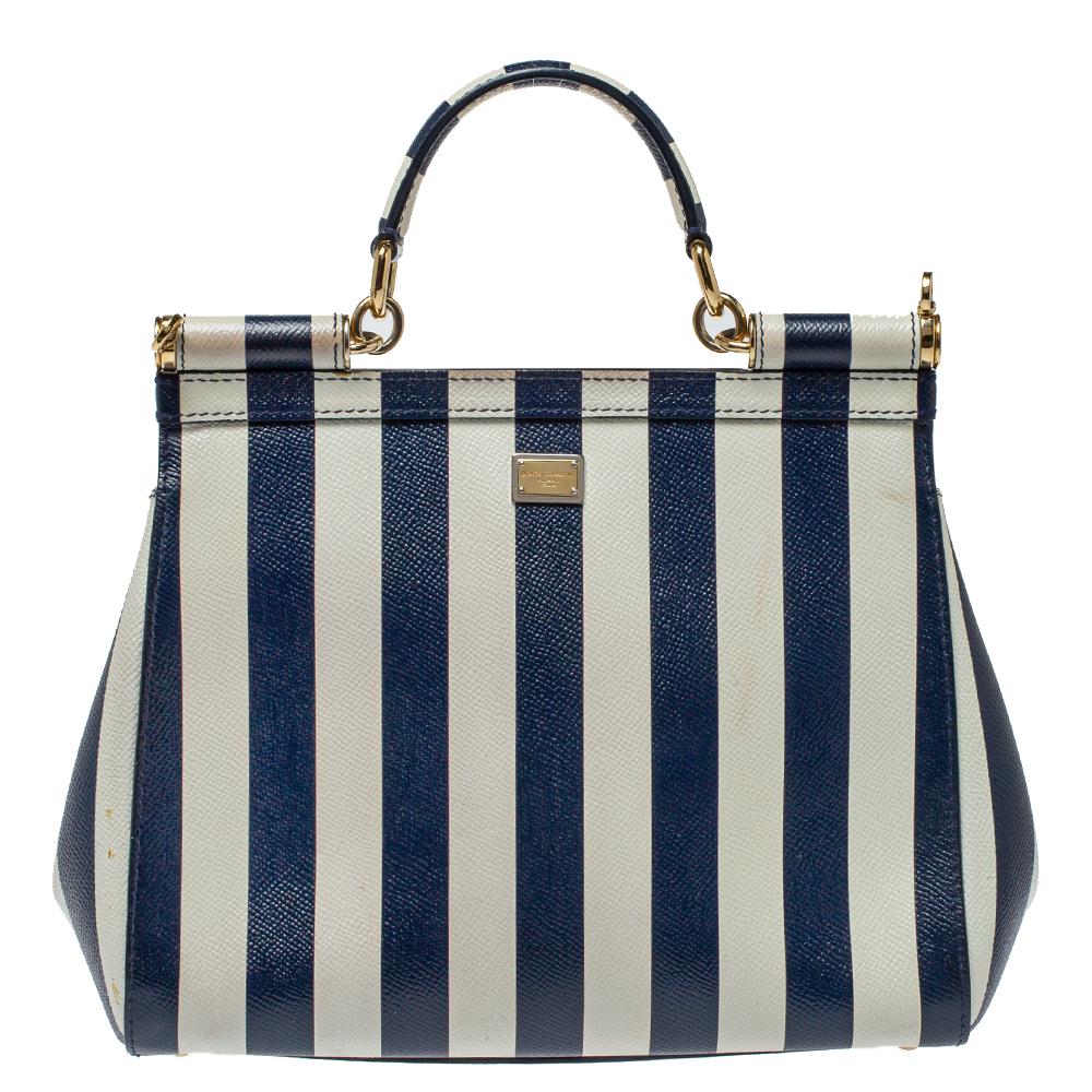 The iconic Miss Sicily bag by Dolce & Gabbana is named after Domenico Dolce's native land and exhibits the aesthetic of Italian glamour. The neat silhouette is made from leather and features stripes all over and a front flap accented with an