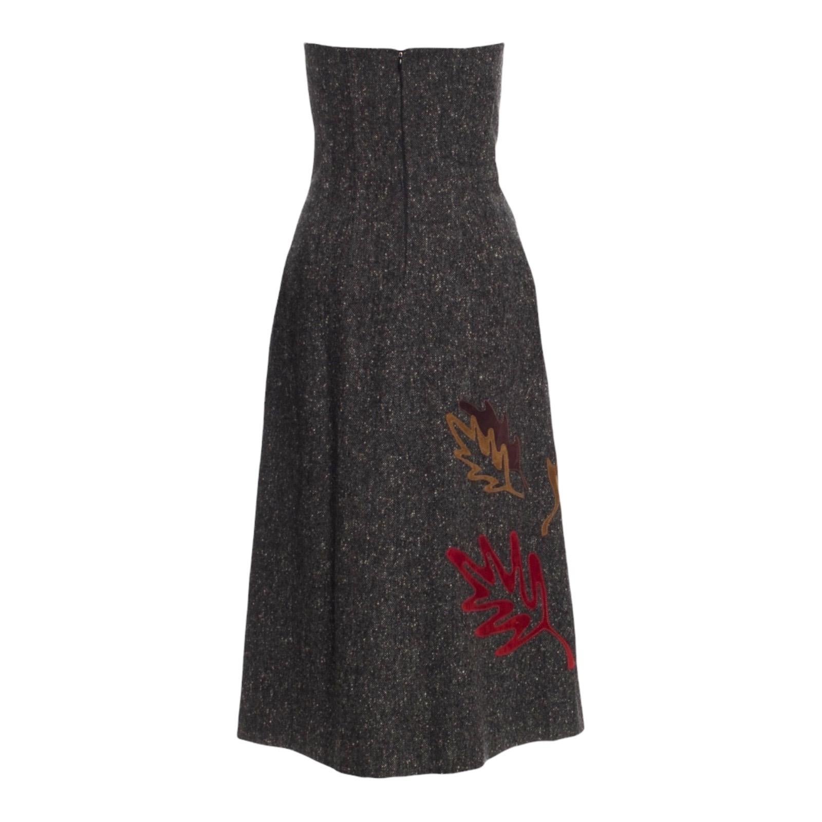 Timeless tweed dress by Dolce & Gabbana
Adjustable lace up detail in front
Corset inside fully boned
Closes with concealed zip
Two side pockets, still stitched up and unopened
Suede leather trimmings
Made in Italy
Dry Clean Only
Size 44, fits best