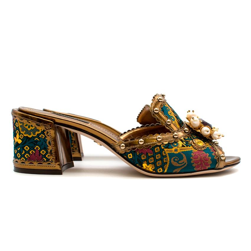 Dolce & Gabbana Brocade Crystal Embellished Mules. RRP £750

- Block heel - Open toe - Crystal and bead embellishment - Leather sole - Gold DG logo on the sole - Coloured pattern detail on toe and heel - Leather patterned trim

Please note, these