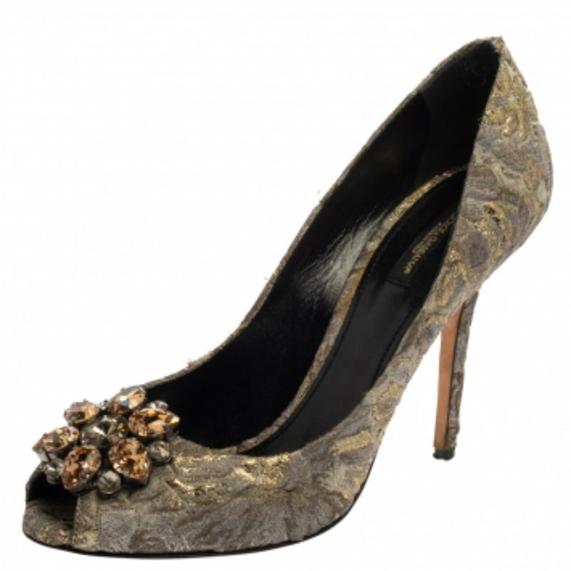 Dolce & Gabbana's Bellucci range pays tribute to Italian actress Monica Bellucci, who has been a longstanding muse of the label. These grey pumps are rendered in brocade fabric printed with floral motifs that evoke the brand's feminine elegance. The