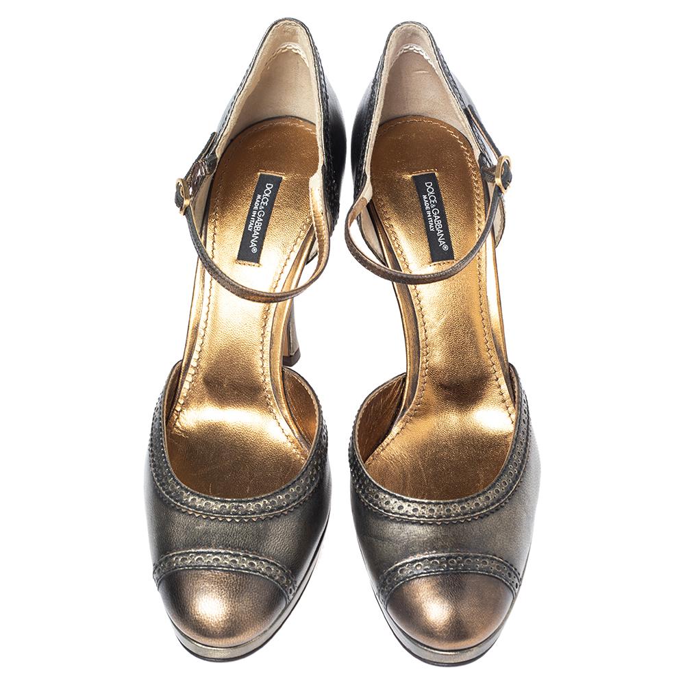 Take your style to another level with this pair of Mary Jane pumps from Dolce & Gabbana. Crafted in Italy from leather, they feature round toes and Mary Jane straps with buckle closures. They are accented with brogue details and 11 cm heels with