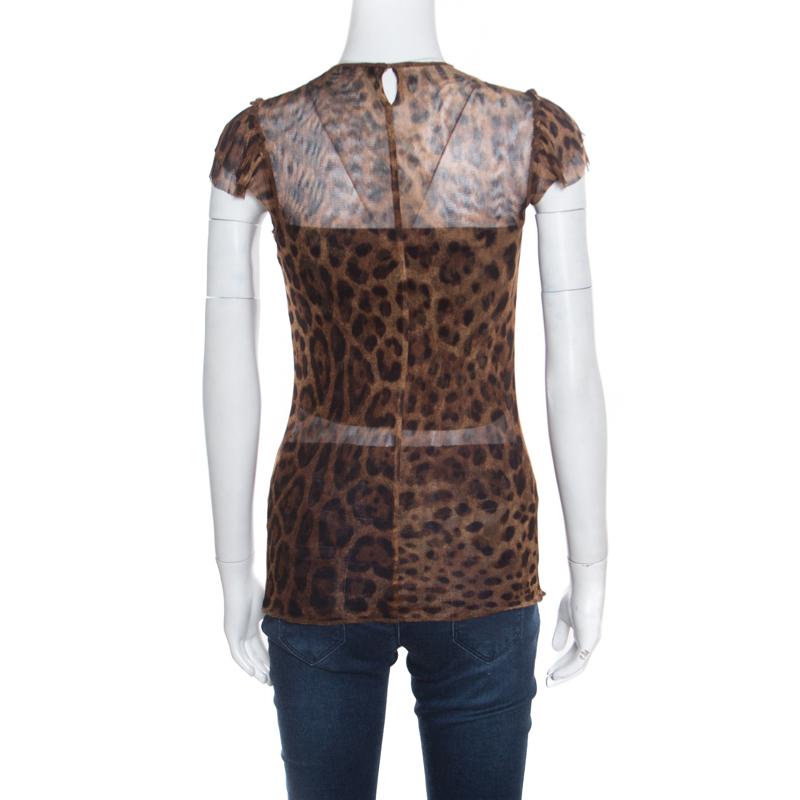 Who doesn't love prints and when it comes to Dolce and Gabbana creations, you are sure to make them a part of your closet! This brown mesh top is made of a nylon and elastane blend and features a leopard print all over it. It flaunts a round